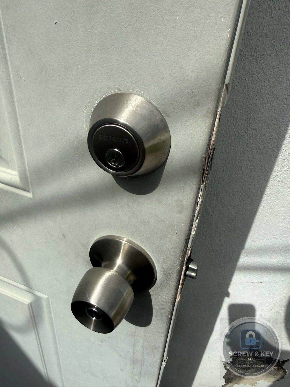 New deadbolt and knob set installed on a residential door