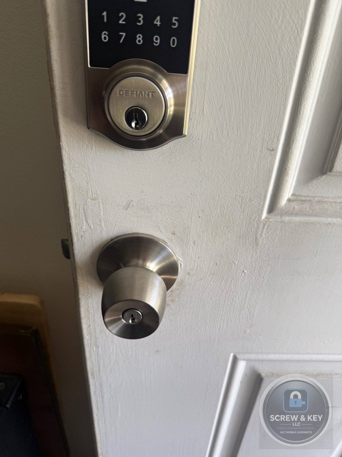 Keypad deadbolt freshly installed on a residential door by Screw and Key LLC